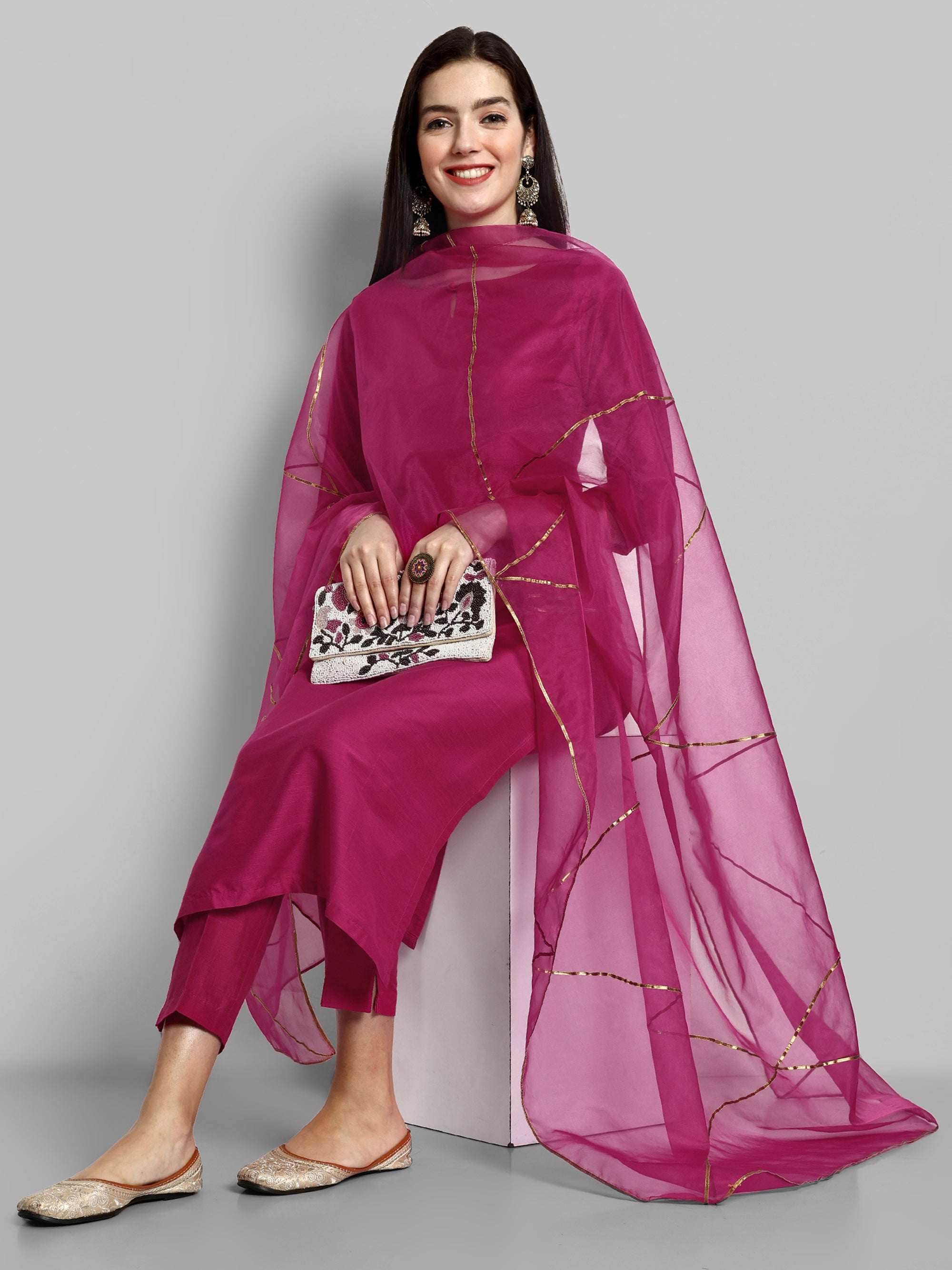 Hot Pink key hole boat neck kurta paired with elasticated pants and an organza dupatta - a stylish set of three for a sophisticated and coordinated look