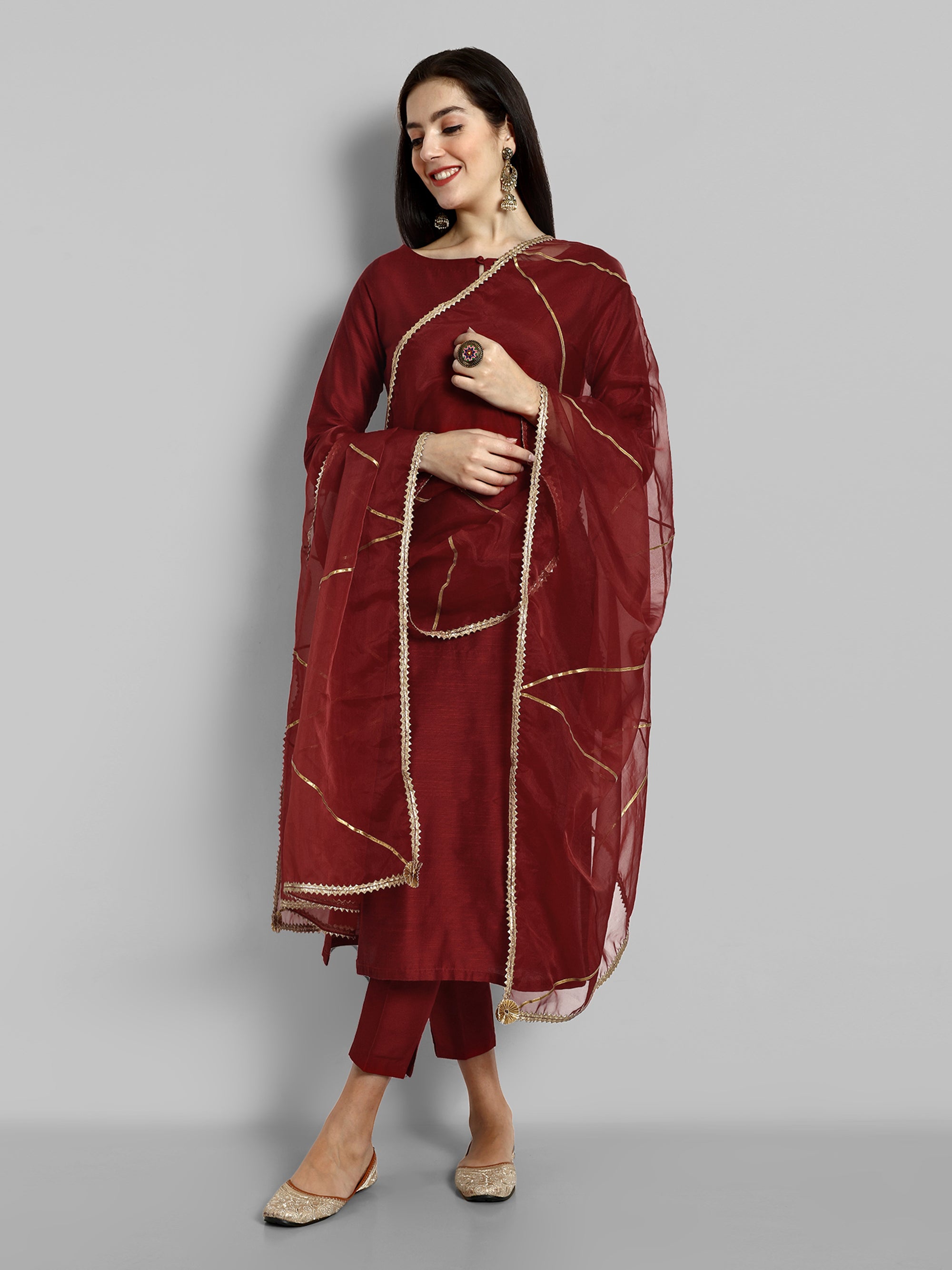 Maroon boat neck kurta paired with elasticated pants and an organza dupatta - a stylish set of three for a sophisticated and coordinated look