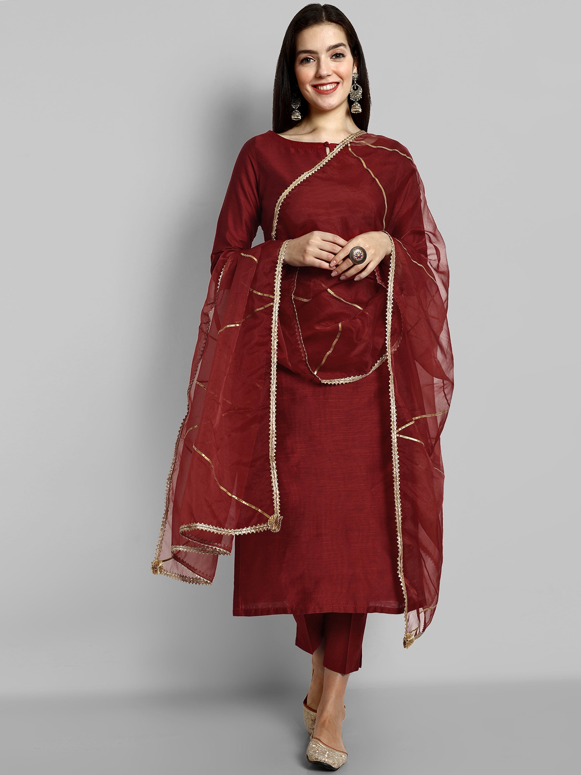 Maroon boat neck kurta paired with elasticated pants and an organza dupatta - a stylish set of three for a sophisticated and coordinated look