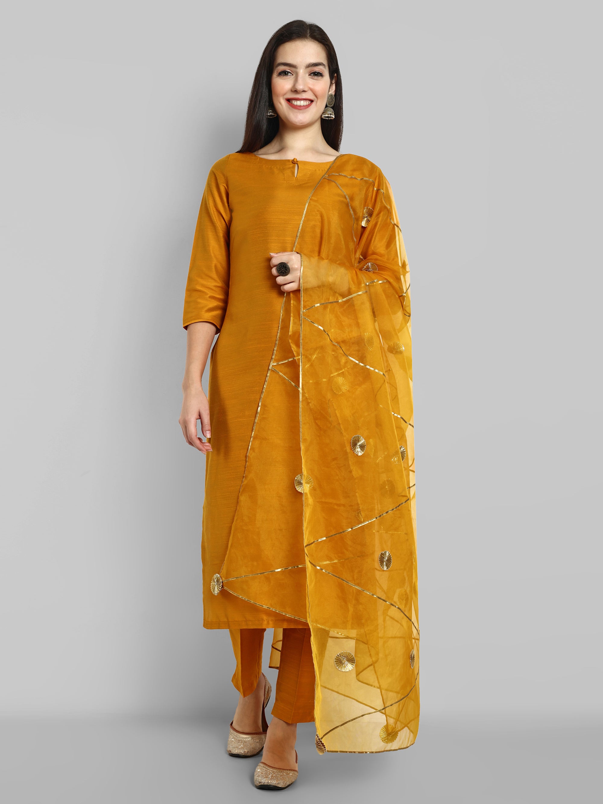 Mustard key hole boat neck kurta paired with elasticated pants and an organza dupatta - a stylish set of three for a sophisticated and coordinated look