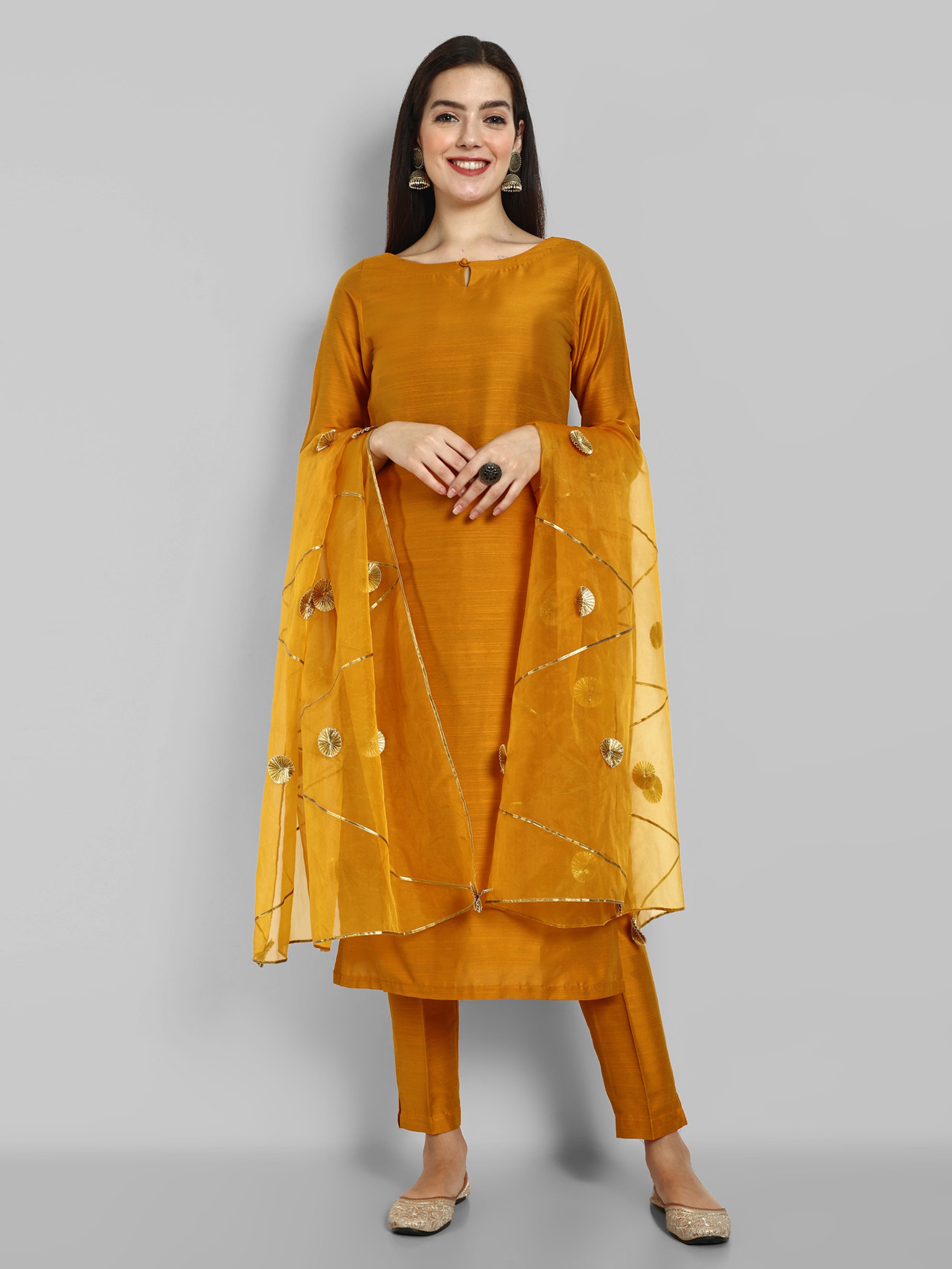 Mustard key hole boat neck kurta paired with elasticated pants and an organza dupatta - a stylish set of three for a sophisticated and coordinated look