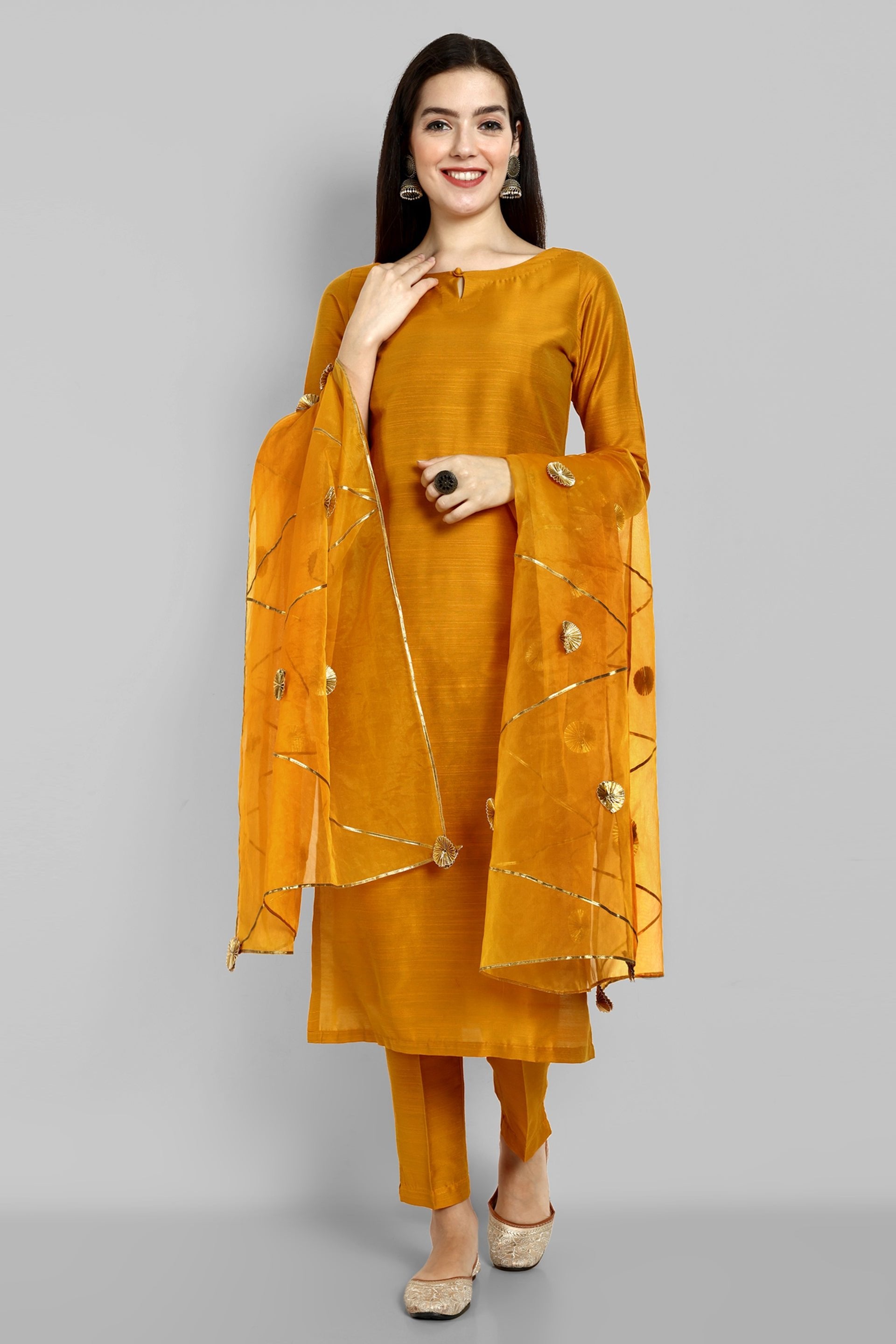 Mustard key hole boat neck kurta paired with elasticated pants and an organza dupatta - a stylish set of three for a sophisticated and coordinated look