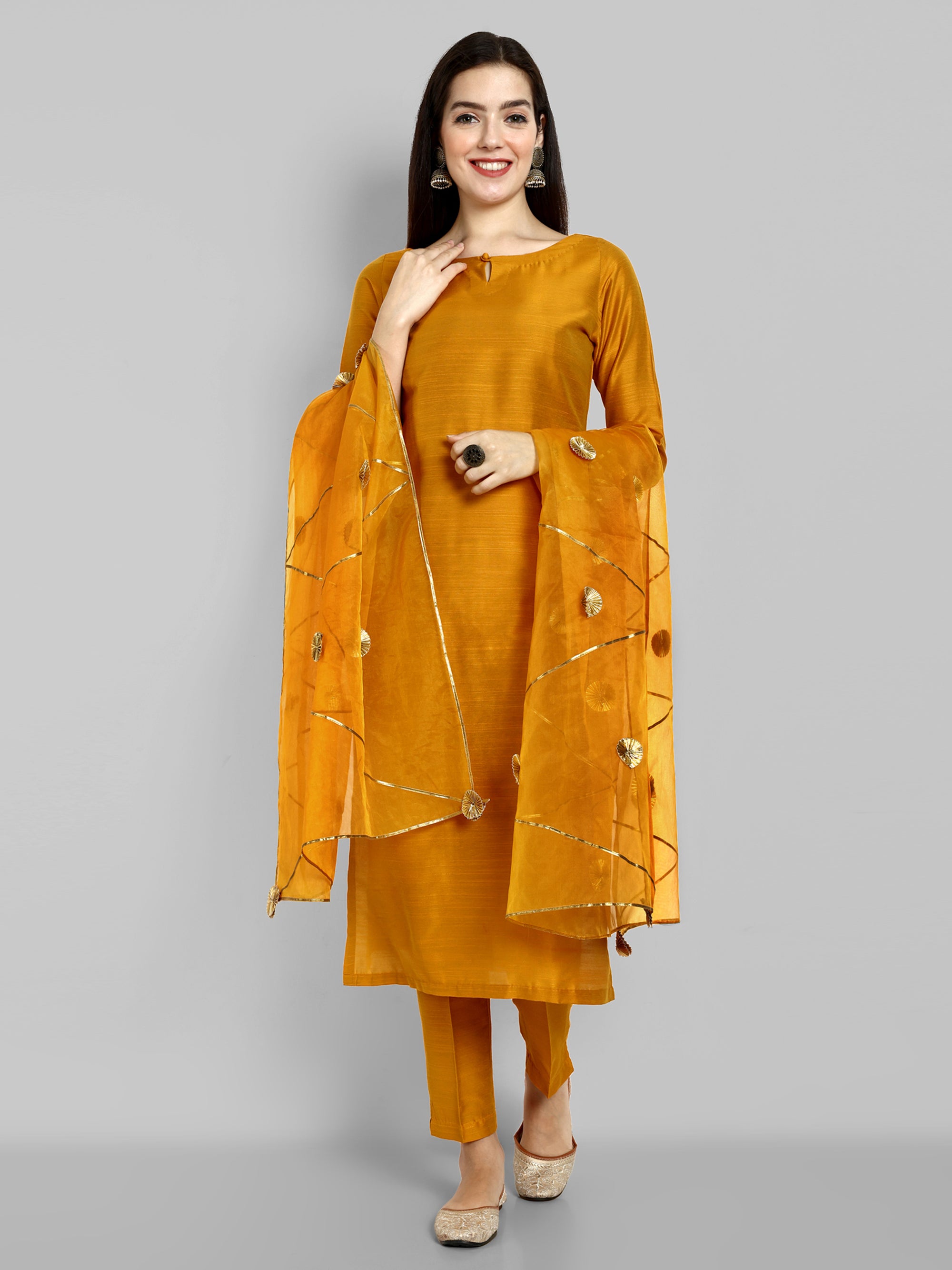 Mustard key hole boat neck kurta paired with elasticated pants and an organza dupatta - a stylish set of three for a sophisticated and coordinated look