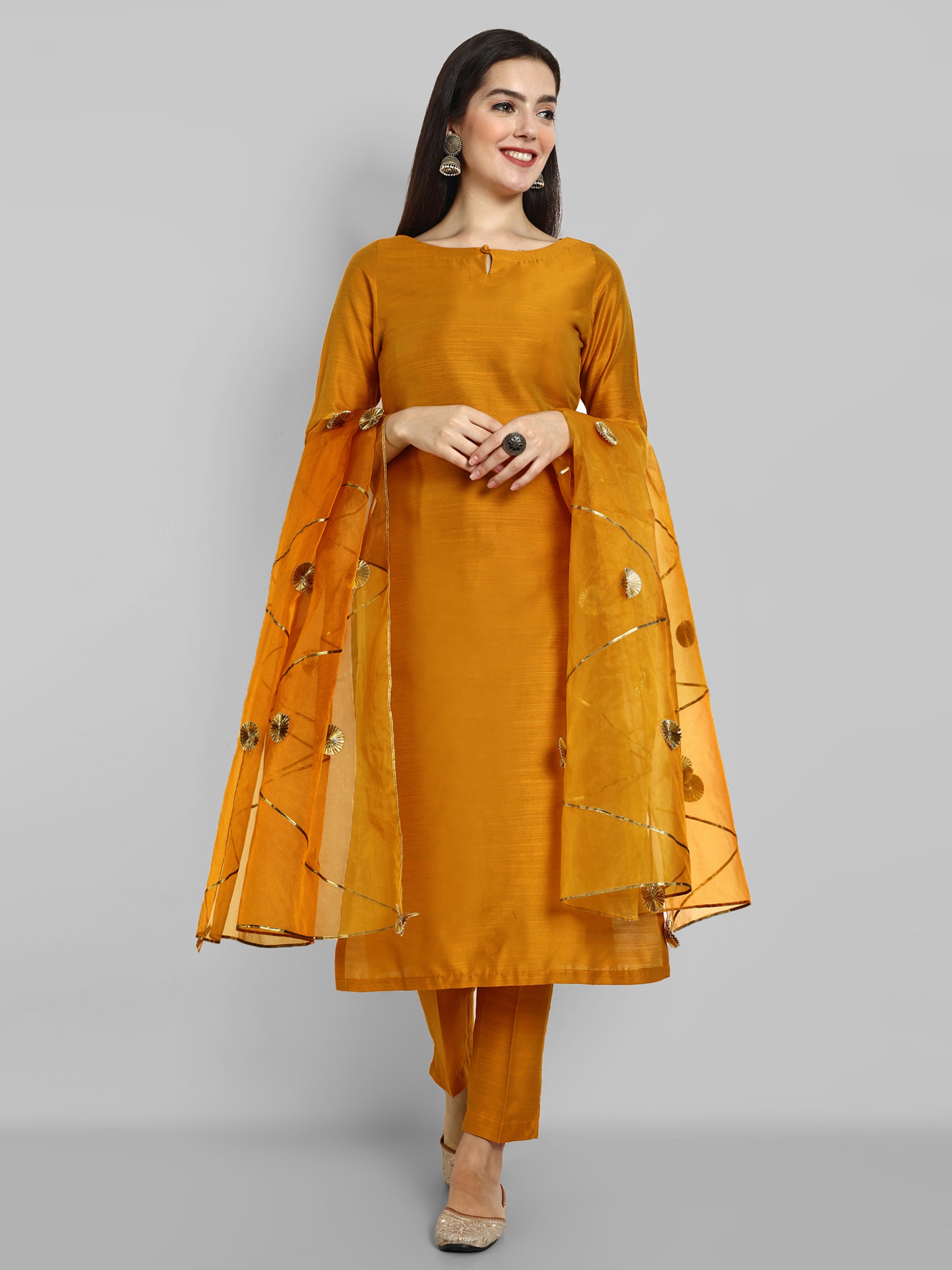 Mustard key hole boat neck kurta paired with elasticated pants and an organza dupatta - a stylish set of three for a sophisticated and coordinated look