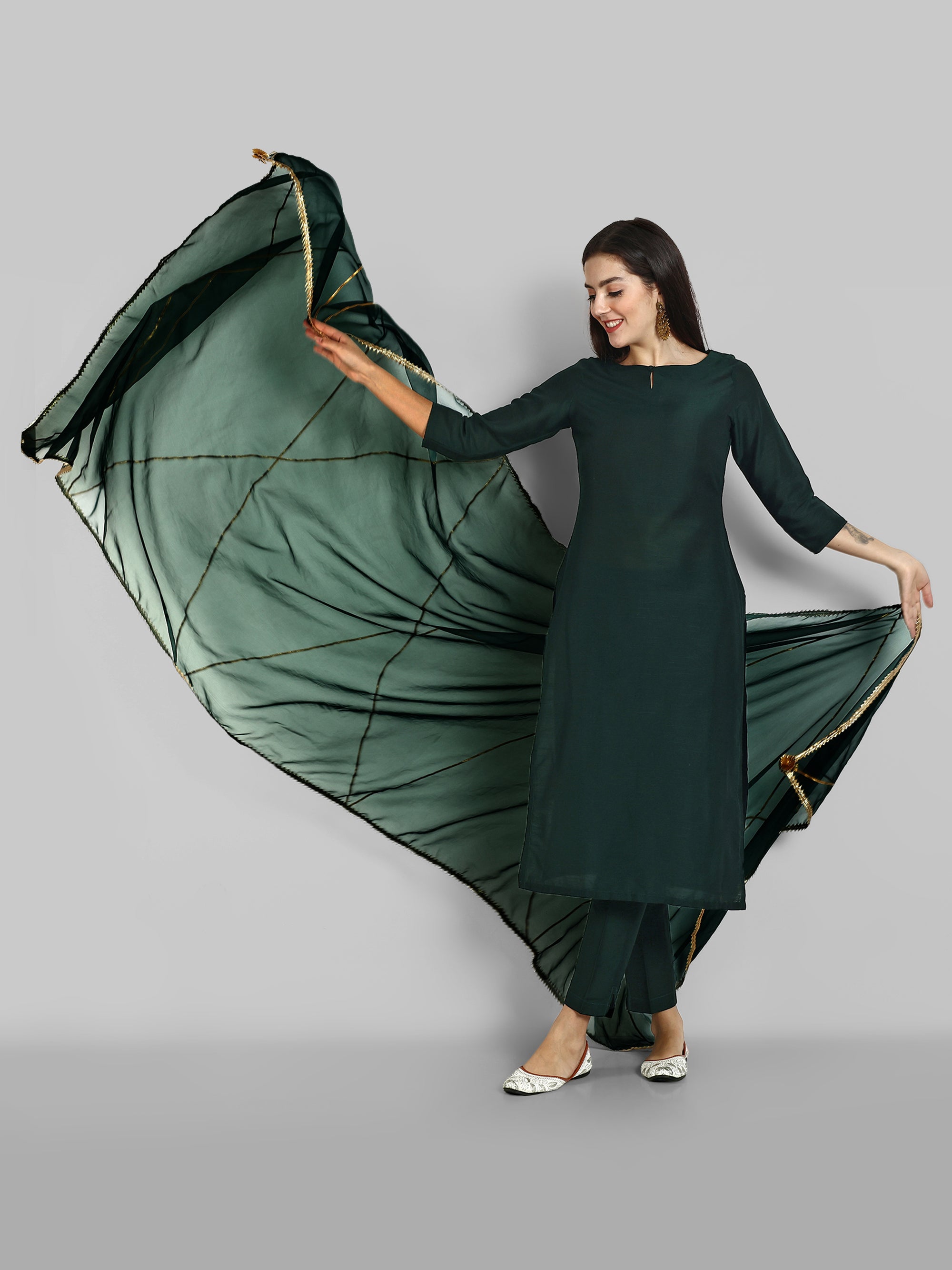 Emerald Bottle Green boat neck kurta paired with elasticated pants and an organza dupatta - a stylish set of three for a sophisticated and coordinated look.