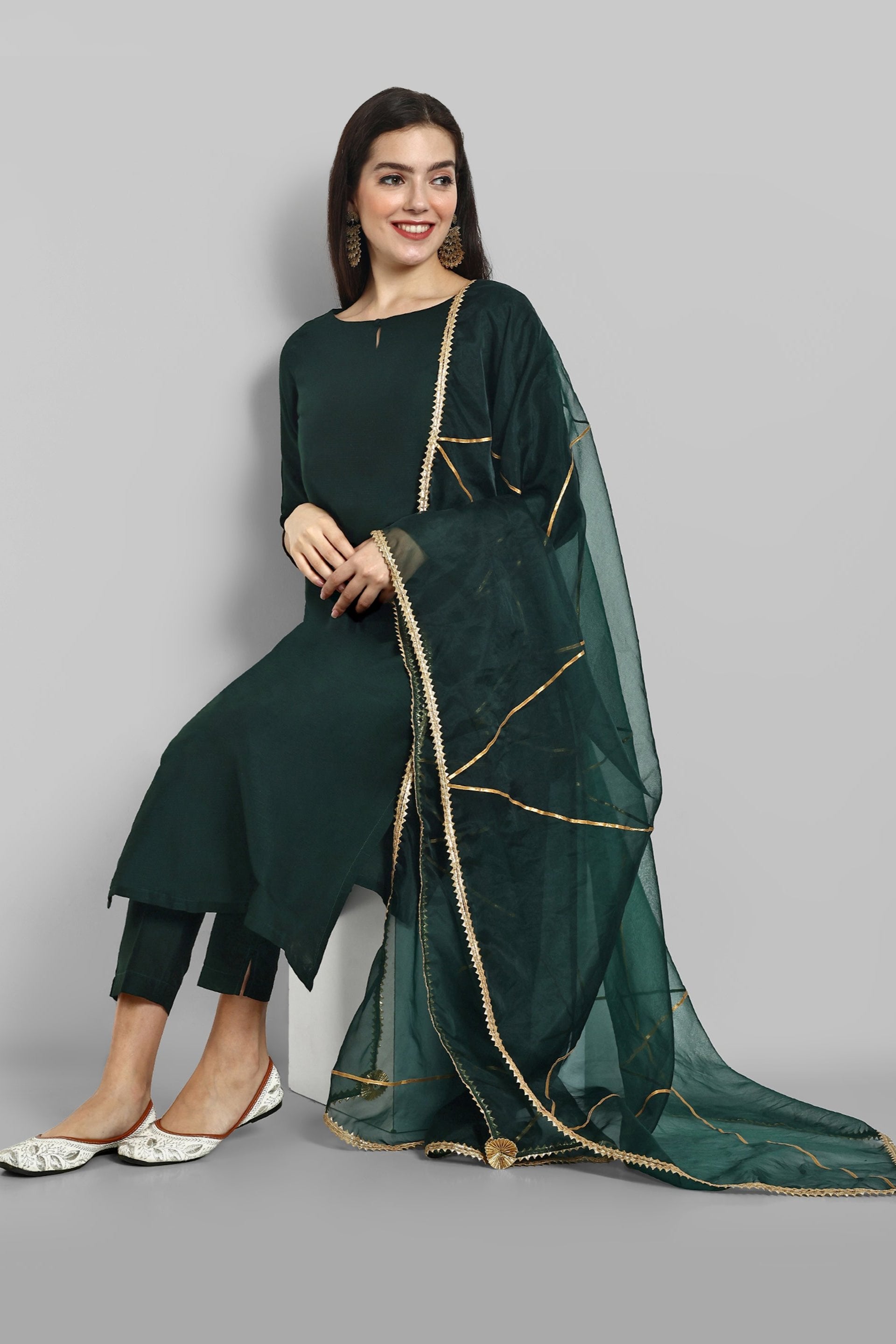 Emerald Bottle Green boat neck kurta paired with elasticated pants and an organza dupatta - a stylish set of three for a sophisticated and coordinated look