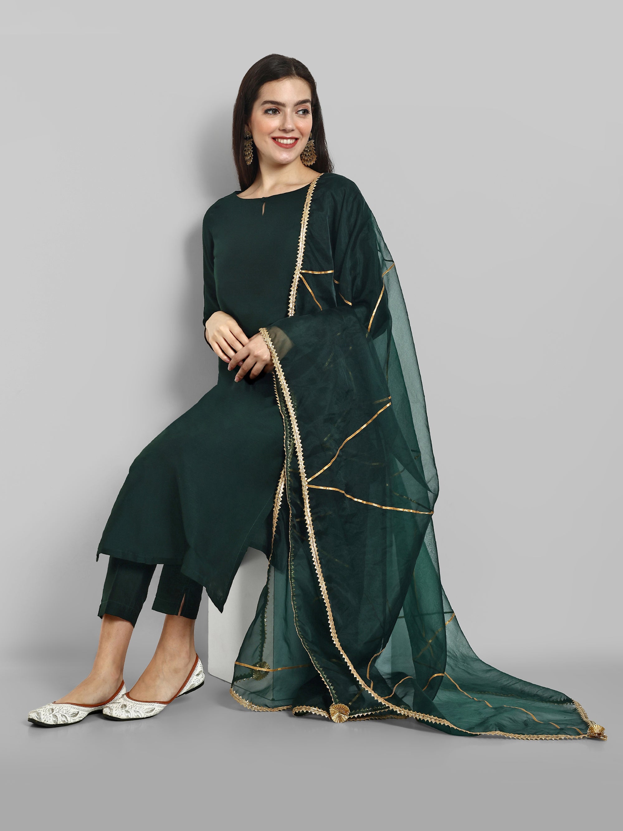 Emerald Bottle Green boat neck kurta paired with elasticated pants and an organza dupatta - a stylish set of three for a sophisticated and coordinated look