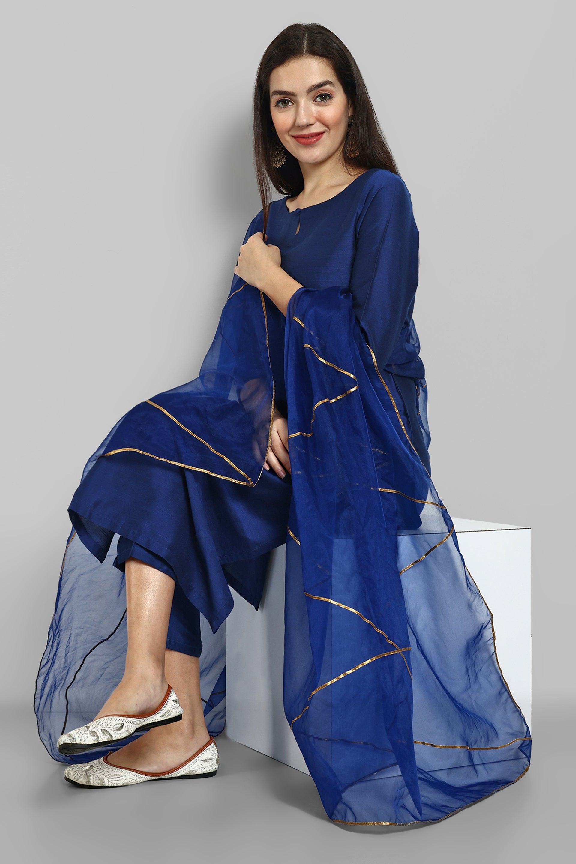 Ink Blue boat neck kurta paired with elasticated pants and an organza dupatta - a stylish set of three for a sophisticated and coordinated look