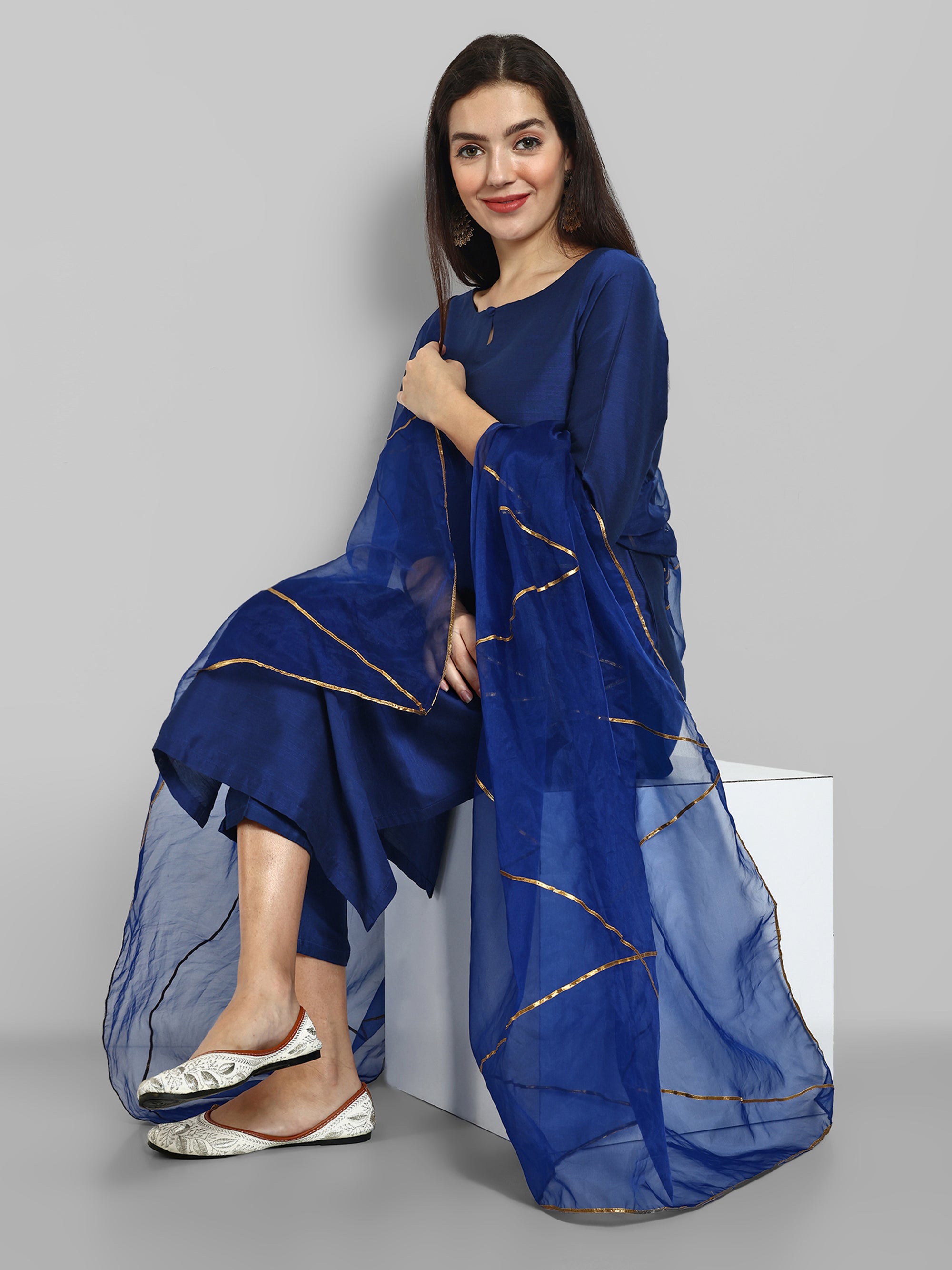 Ink Blue boat neck kurta paired with elasticated pants and an organza dupatta - a stylish set of three for a sophisticated and coordinated look