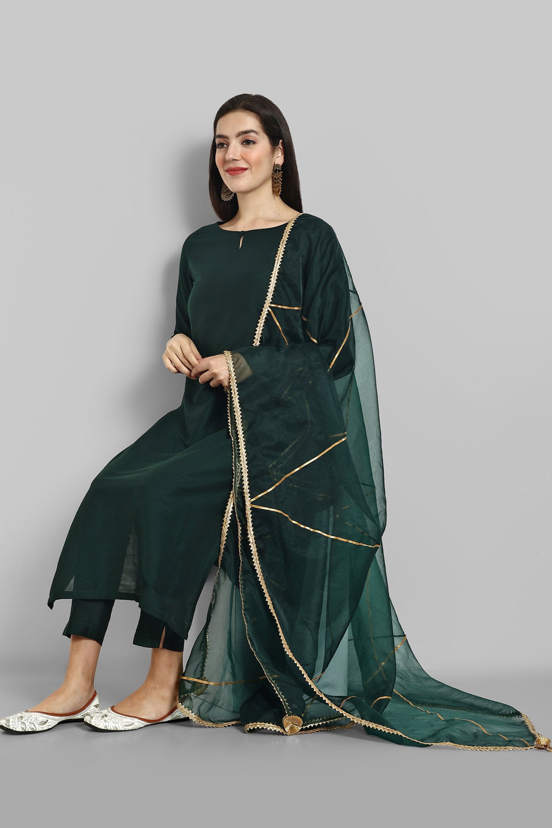 Emerald Bottle Green boat neck kurta paired with elasticated pants and an organza dupatta - a stylish set of three for a sophisticated and coordinated look