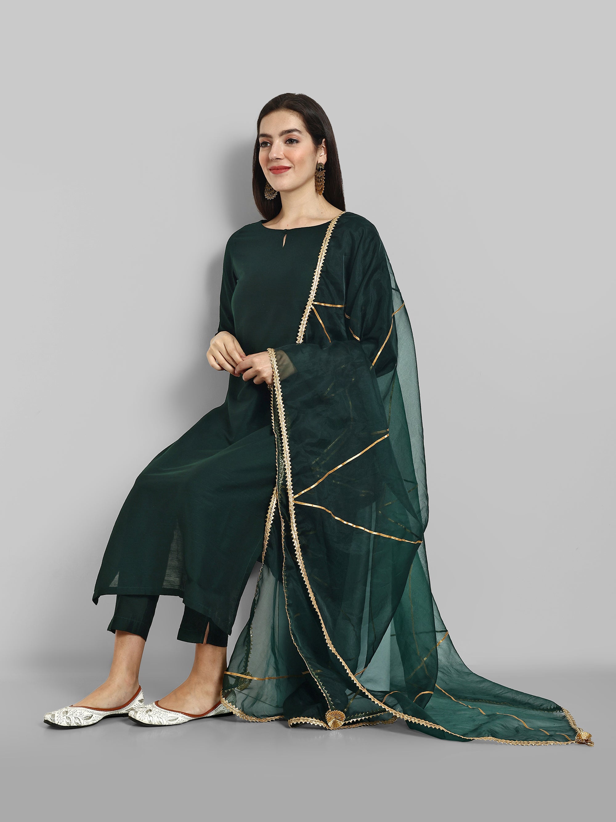 Emerald Bottle Green boat neck kurta paired with elasticated pants and an organza dupatta - a stylish set of three for a sophisticated and coordinated look